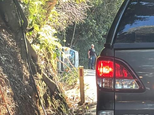 A man has been checked by QAS personnel following a single-vehicle crash on the Kuranda Range Road. Photo: Facebook.