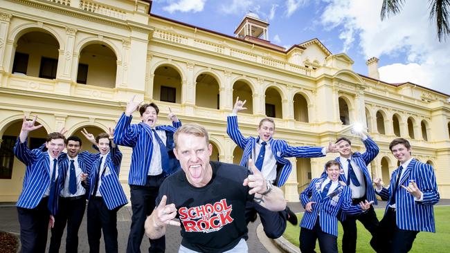 Former Nudgee College student Matt Crowley is back in Brisbane performing with 'School of Rock'. Friday August 3, 2019. Matt Crowley poses for a photograph at Nudgee College with students Enrico Contarino, Malakai Vale, Oscar Scarcia, Matt Voysey, Parker Prout, Marcus Cutuli, Jamie Dickman and Ben Rohan. (AAP Image- Renae Droop)