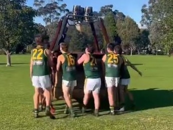 Hampton Rovers players move a hot air balloon basket. Picture: Hampton Rovers Twitter