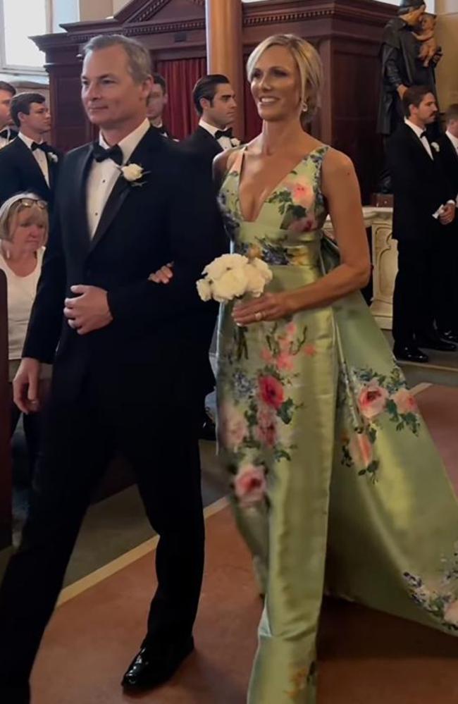 Lori DeWitt wore a custom Audrey + Brooks dress with a plunging neckline, detachable bow and train. Picture: Instagram