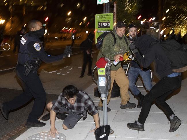 Members of the Proud Boys clash with Black Lives Matter protesters during the Million MAGA March in Washington, DC. PICTURE: Getty Images/AFP