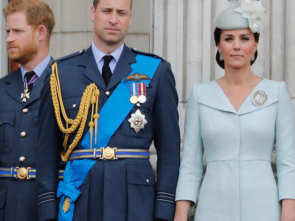 Kate Middleton stands out on the balcony of Buckingham Palace in 2018 in an ice blue coat dress. Image: by Tolga AKMEN / AFP.