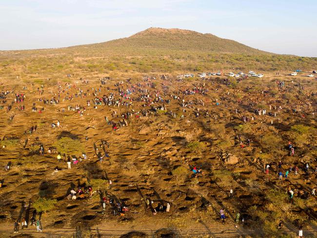 Around 1000 people have descended on the site. Picture: Phill Magakoe/AFP