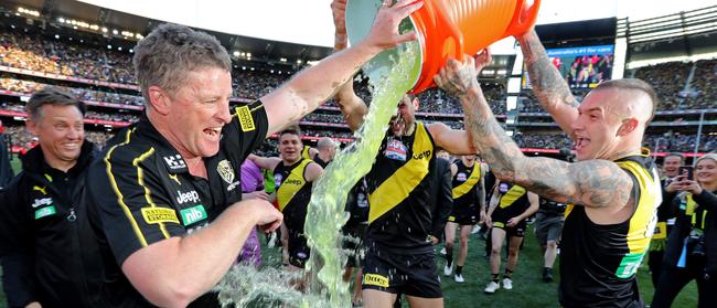 Dustin Martin dumps Gatorade over two-time premiership coach Damien Hardwick. Picture: Michael Klein.