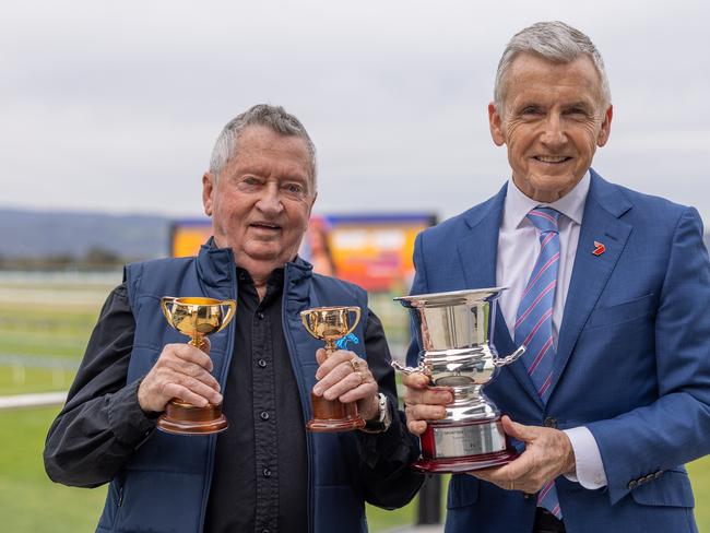 John Letts and close friend Bruce McAvaney pose with Letts' two Melbourne Cups and the John Letts Cup. Picture: Racing SA