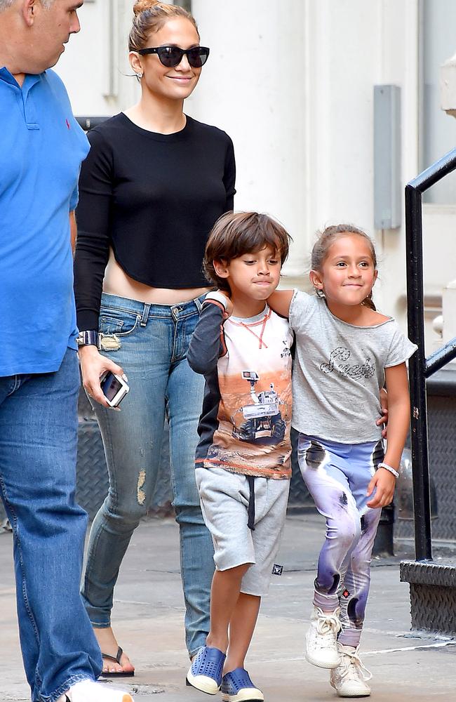 MUST CREDIT SPLASH WEB RIGHTS ONLY UK CLIENTS MUST CREDIT: AKM-GSI ONLY New York, NY - Jennifer Lopez gets some family time with her twins Max and Emme today in New York after performing at the iHeart Radio Ultimate Pool Party in Miami over the weekend. The singer stayed covered up this afternoon with the exception of exposing a little bit of her midriff wearing a black crop top with skinny jeans and flip flops. Jennifer walked close behind her little ones as they walked around the city with their bodyguard and a couple of friends. Pictured: Jennifer Lopez Ref: SPL793257 300614 Picture by: AKM-GSI / Splash News