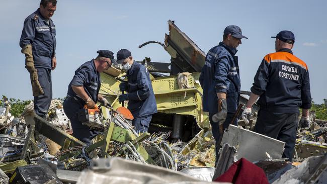 Crash site ... Ukrainian rescue servicemen inspect part of the wreckage of MH17 in Rassipnoye, Ukraine. Pic: Rob Stothard/Getty Images