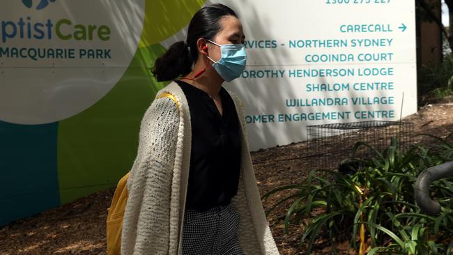 A woman walks past the Dorothy Henderson Lodge. Picture: Jane Dempster