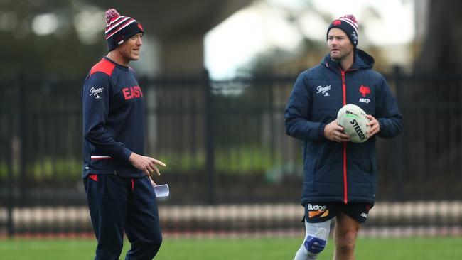 Sydney Roosters assistant coach Craig Fitzgibbon with Boyd Cordner during a training session at Moore Park on Monday. Picture: Brett Costello