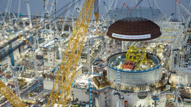 A 245-tonne steel dome descends onto Hinkley Point C's first reactor building.