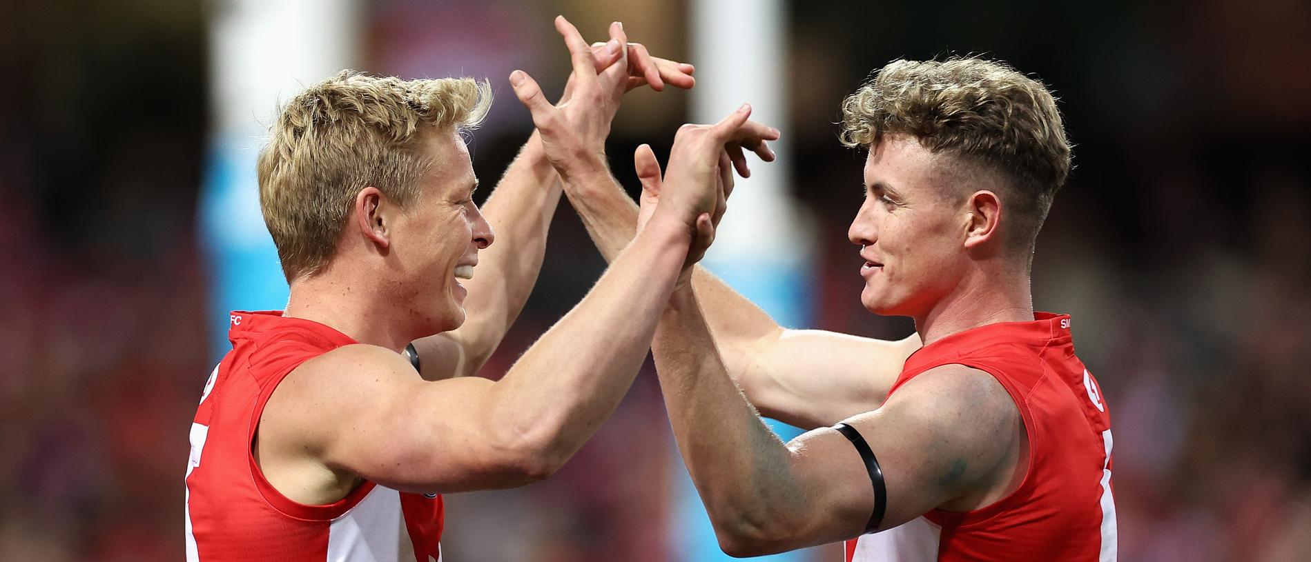 SYDNEY, AUSTRALIA - JUNE 24: IsaacÂ Heeney of the Swans 
celebrates kicking a goal with ChadÂ Warner of the Swans during the round 15 AFL match between Sydney Swans and West Coast Eagles at Sydney Cricket Ground, on June 24, 2023, in Sydney, Australia. (Photo by Cameron Spencer/Getty Images)