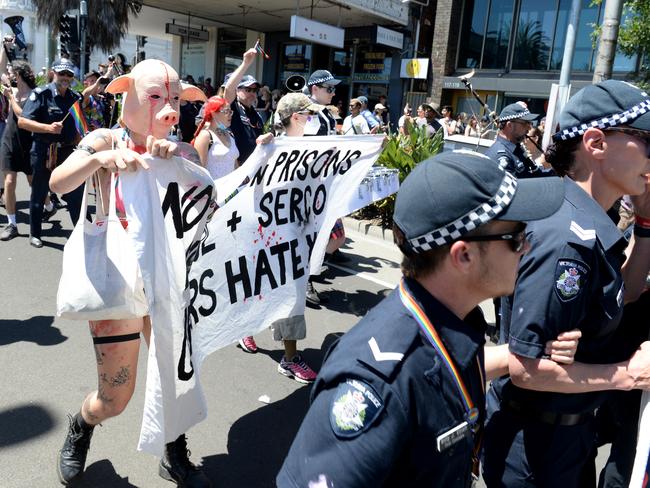 Police were confronted by protesters who surrounded them in an attempt to stop them marching. Picture: Andrew Henshaw