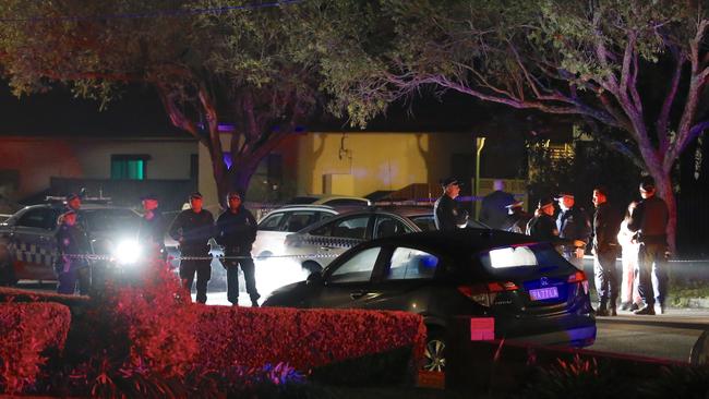 Police officers at the crime scene in Panania. Picture: Steve Tyson