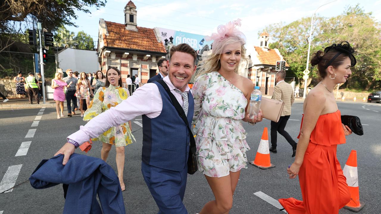 Punters leave Eagle Farm racecourse on Melbourne Cup Day.