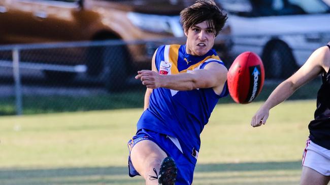 Bailey Stevens gets a kick away for Heathmont. Picture: Chris Mirtschin