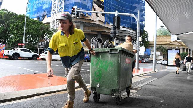 Subcontractors and tradesmen pack up their equipment and walk off the 443 Queens Street construction site in Brisbane on Thursday. Picture: NCA NewsWire/Dan Peled