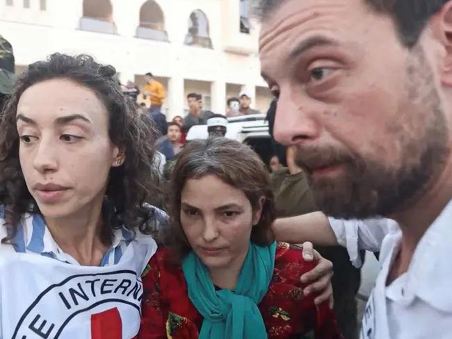 Amit Soussana who was taken hostage by Hamas during the October 7 attack on Israel is escorted by members of the International Red Cross on November 30, 2023. Picture: Hamas Military Wing