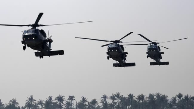 Three anti-submarine S-70C helicopters fly in formation during an annual drill at the Tsoying navy base in Kaohsiung, southern Taiwan. Picture: AFP