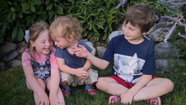 Talia, Oliver and Michael together. Talia is a carrier of the rare disease her brothers have been diagnosed with. Picture: Caters News