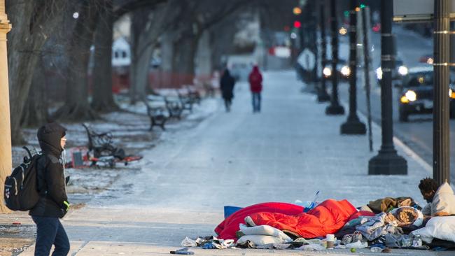 While the stricken denizens of Trumpworld receive the latest in cutting-edge medical treatment, Washington’s 7,000-strong, mostly African-American homeless population is faced with a far starker problem as winter deepens. Picture: AFP