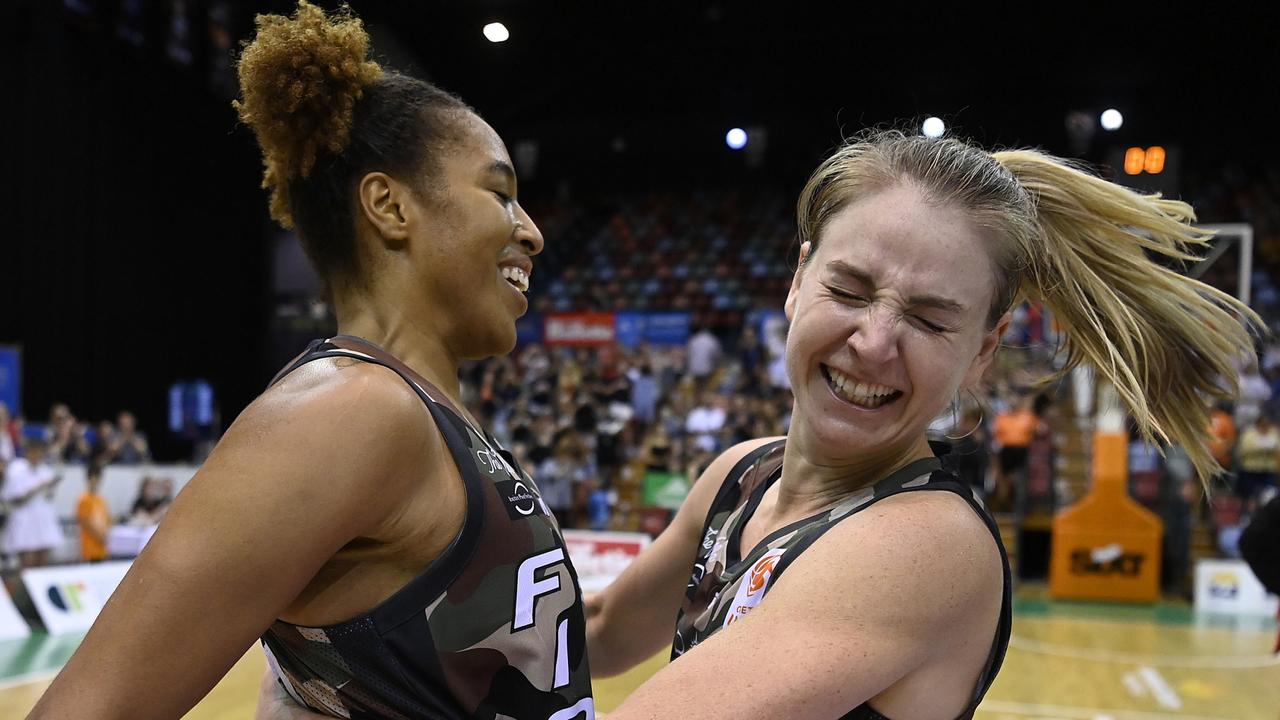 Tianna Hawkins and Karlie Samuelson of the Fire celebrate after beating the Sydney Flames in Townsville. (Photo by Ian Hitchcock/Getty Images)