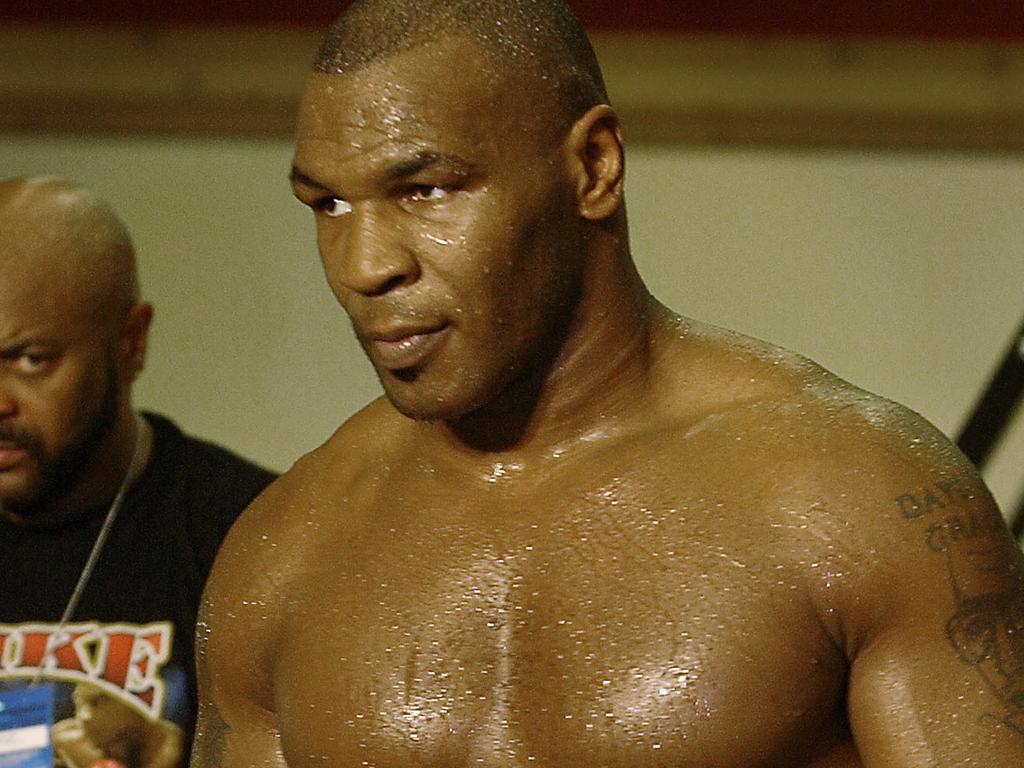 Mike Tyson made it back to the top in 2002 — but lost his championship fight with Lennox Lewis.