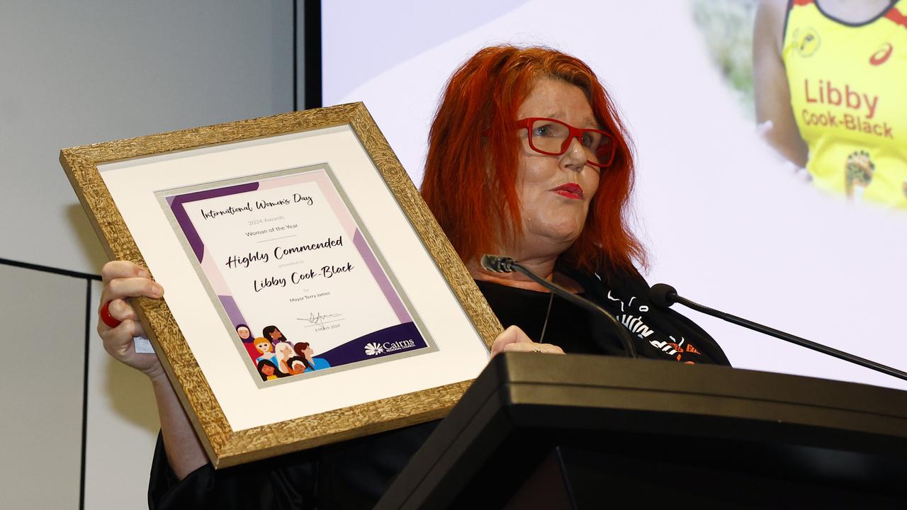 Amanda Black accepts the Cairns Woman of the Year highly commended award on behalf of her daughter Libby Cook-Black at the Cairns Regional Council's International Women's Day 2024 awards, held at the Cairns Convention Centre. Picture: Brendan Radke