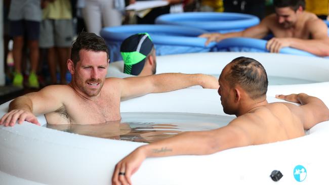 Bernard Foley and Christian Lealiifano of Australia sit in an ice bath in Odawara.