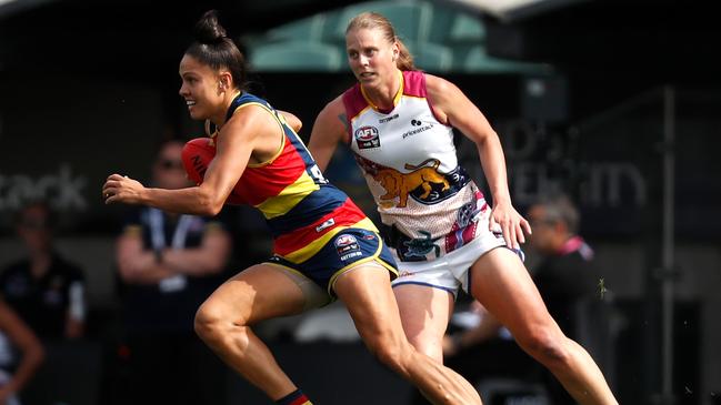 The Crows’ Stevie-Lee Thompson and the Lions’ Kate Lutkins during the AFLW grand final. Picture: Getty Images