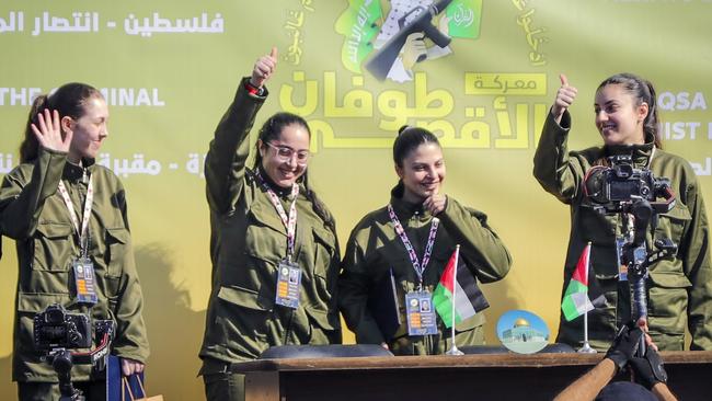 Daniella Gilboa (2nd L) with Naama Levy, Karina Ariev and Liri Albag, before being handed over to the Red Cross in Gaza City. Picture: AFP.