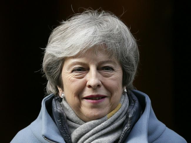 Britain's Prime Minister Theresa May leaves 10 Downing street in London, Thursday, March 14, 2019. British lawmakers faced another tumultuous day Thursday, as Parliament prepared to vote on whether to request a delay to the country's scheduled departure from the European Union and Prime Minister Theresa May struggled to shore up her shattered authority. (AP Photo/Tim Ireland)