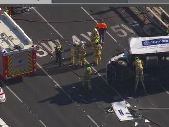 Police and firefighters swarmed the crash scene on the West Gate Bridge.