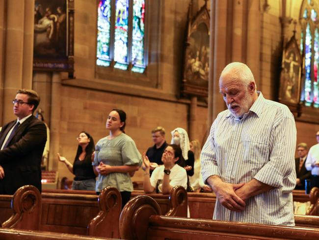 Members of the public seen during Mass after a special tribute to George Pell at St Mary’s Cathedral. Picture: Gaye Gerard