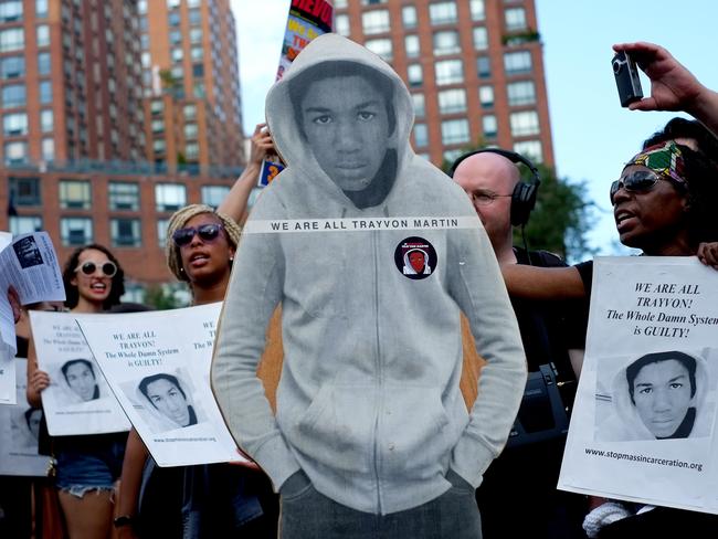 Activists on Union Square stand with a cut out photo of Trayvon Martin on July 14, 2013. AP Photo/Craig Ruttle