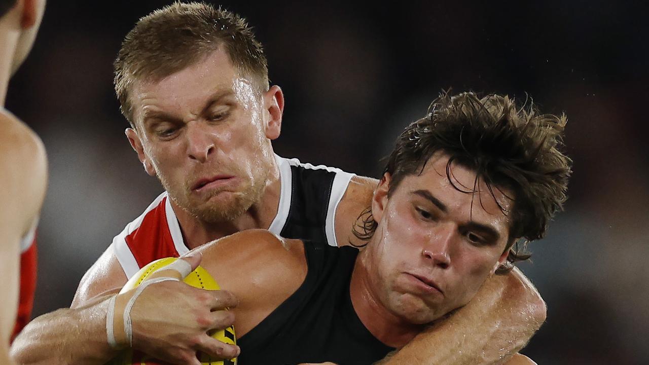 Seb Ross (left) caught Essendon midfielder Sam Durham high in the third-quarter tackle that left him concussed and with a minor shoulder injury. Picture: Michael Klein