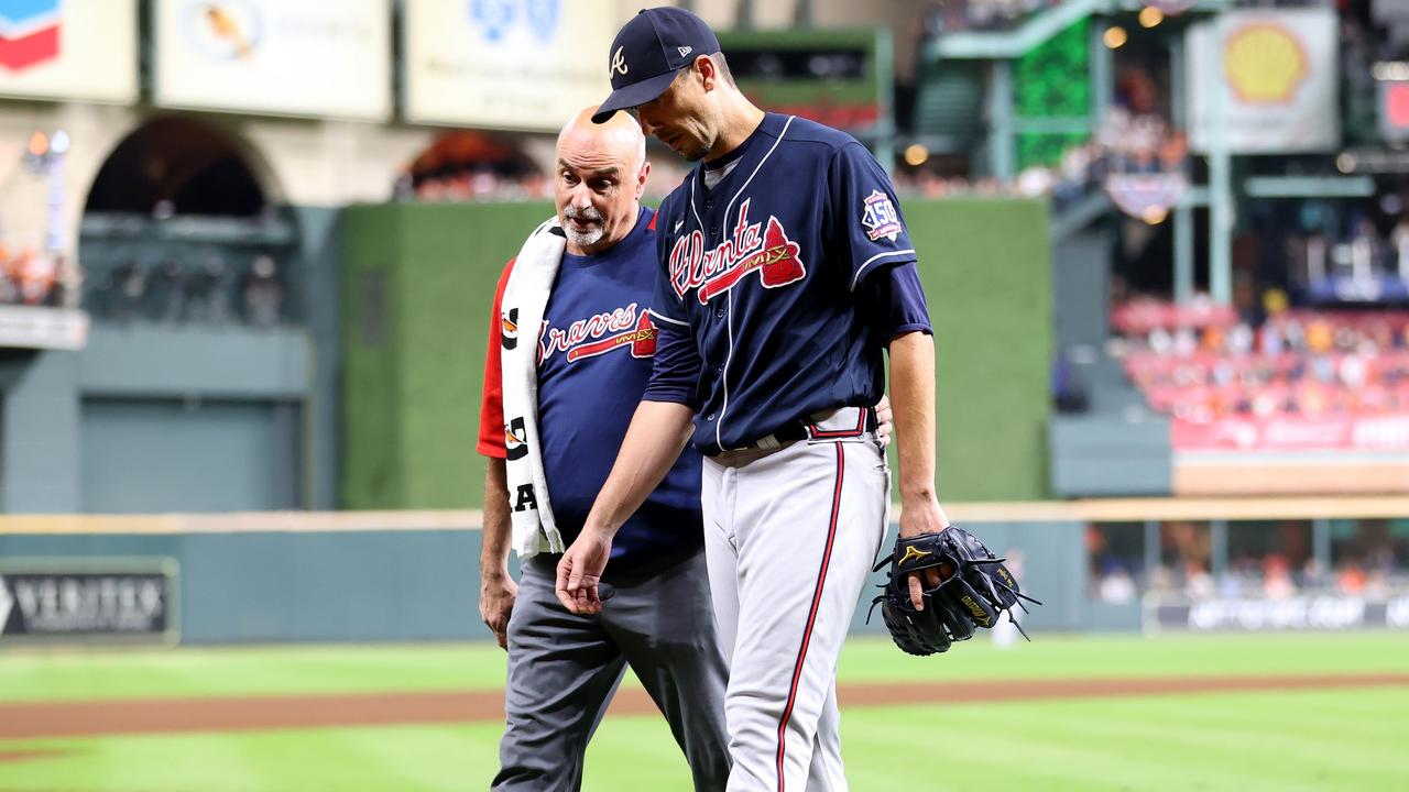 Charlie Morton leaves the field after playing through a broken leg. (Photo by Carmen Mandato/Getty Images)