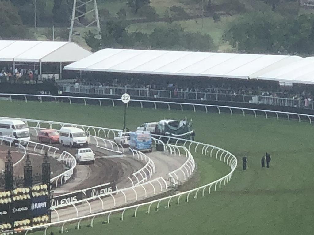 Tarps were pulled up trackside.