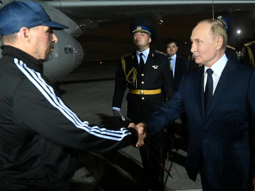 Russia's President Vladimir Putin greets Russian national Vadim Krasikov, who was released in a prisoner exchange between Russia with Western countries, during a welcoming ceremony at Vnukovo International Airport in Moscow, Russia August 1, 2024. Sputnik/Mikhail Voskresensky/Pool via REUTERS ATTENTION EDITORS - THIS IMAGE WAS PROVIDED BY A THIRD PARTY.