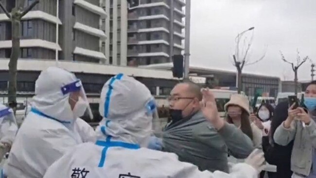 Shanghai residents have shared footage of what they say is police ordering them to leave their homes so the buildings can be used for Covid quarantine. Video: Jennifer Zeng/Twitter