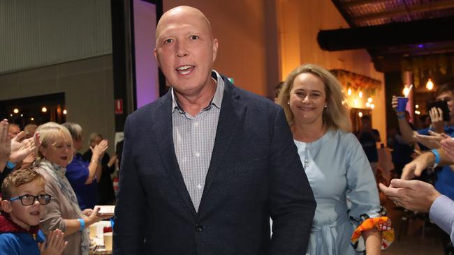 Defence Minister and Federal Liberal member for Dickson, Peter Dutton at his election party in Brendale alongside wife Kirilly. Picture: Zak Simmonds