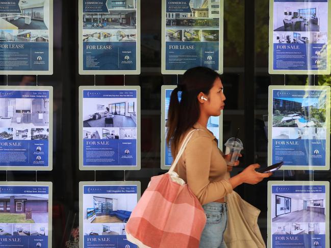 SYDNEY, AUSTRALIA - NOVEMBER 15: A pedestrian walks past a real estate agency in the central business district (CBD) on November 15, 2023 in Sydney, Australia. The Reserve Bank of Australia raised its key benchmark rate last week as inflation continues to hobble a strong economic recovery. The higher rates, in addition to low housing stock, had led many into a situation of housing stress in both the rental and owner-occupier markets. (Photo by Lisa Maree Williams/Getty Images)