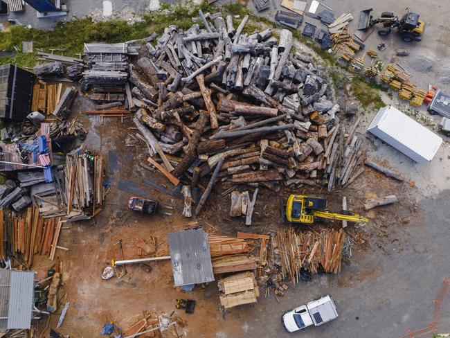 The Beaches Timber has a 400-tonne pile of logs, felled by local tree loppers, in its timber mill at Ingleside. Picture: Beaches Timber