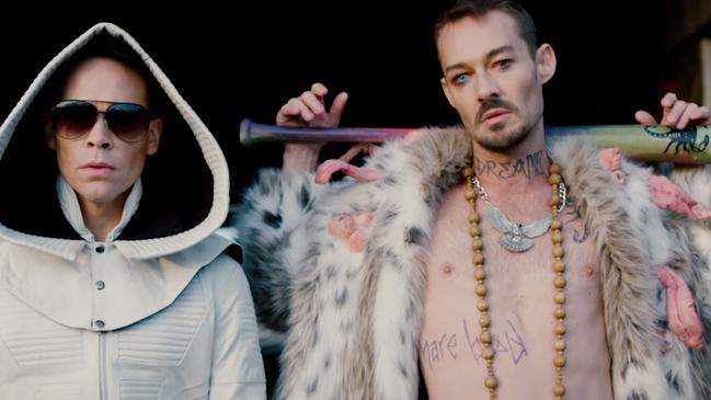 Daniel Johns, right, turned up for his DREAMS photo shoot with Luke Steele with the band name etched across his throat. Picture: YouTube