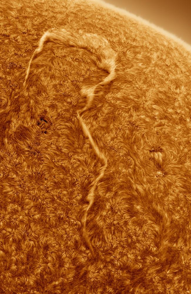 A Sun Question by Eduardo Schaberger Poupeau. This image was the winner in the Our Sun category. It features a huge filament in the shape of a question mark on the Sun. Solar filaments are arcs of plasma in the Sun’s atmosphere given shape by magnetic fields. Location: Argentina.