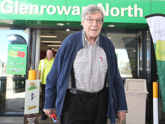 Apologising for his attire, George Pell spoke to media briefly at a service station on his way from Kew to Homebush. Picture: David Geraghty