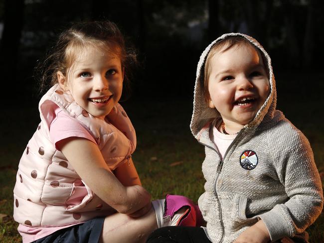 Mia Wilkinson, 7, and Carrie Giles, 2, posing at Kallangur, Brisbane 25th of June 2020.  Mia and Carrie both lost their limbs due to complications with Sepsis.  (Image/Josh Woning)