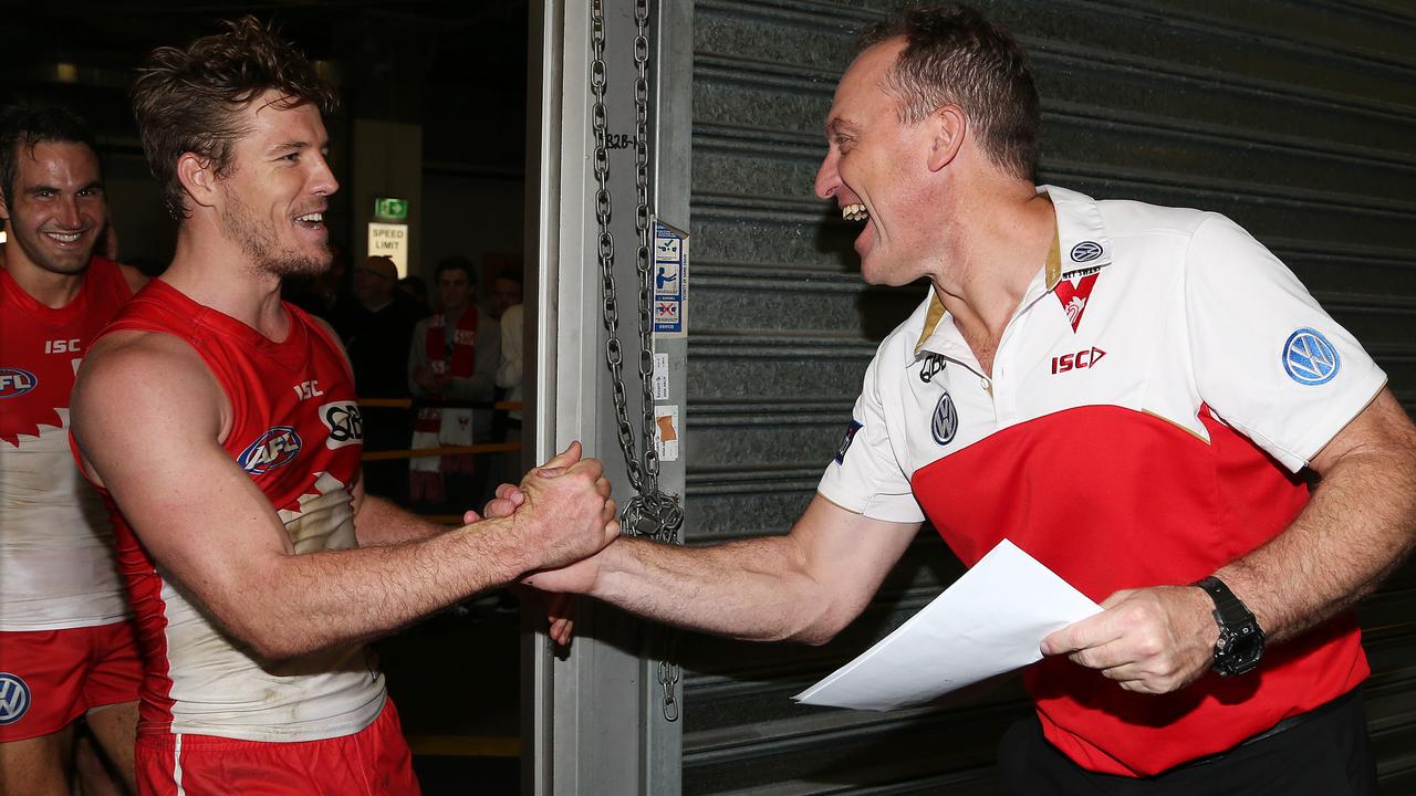 Luke Parker (left) says longtime coach John Longmire has enjoyed sustained success by identifying which trends in the game the Swans should focus on and which ones they should ignore. Picture: George Salpigtidis