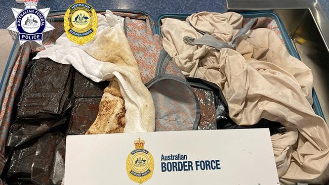 A New Zealand national has been charged with allegedly importing 20kg of cocaine into Australia concealed in his luggage. Picture: AFP