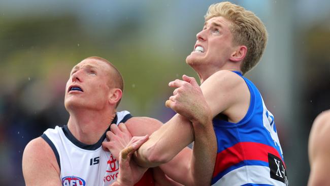 Bulldog Tim English battles with Adelaide's Sam Jacobs in what will be his last game for the Crows. Picture: Michael Klein