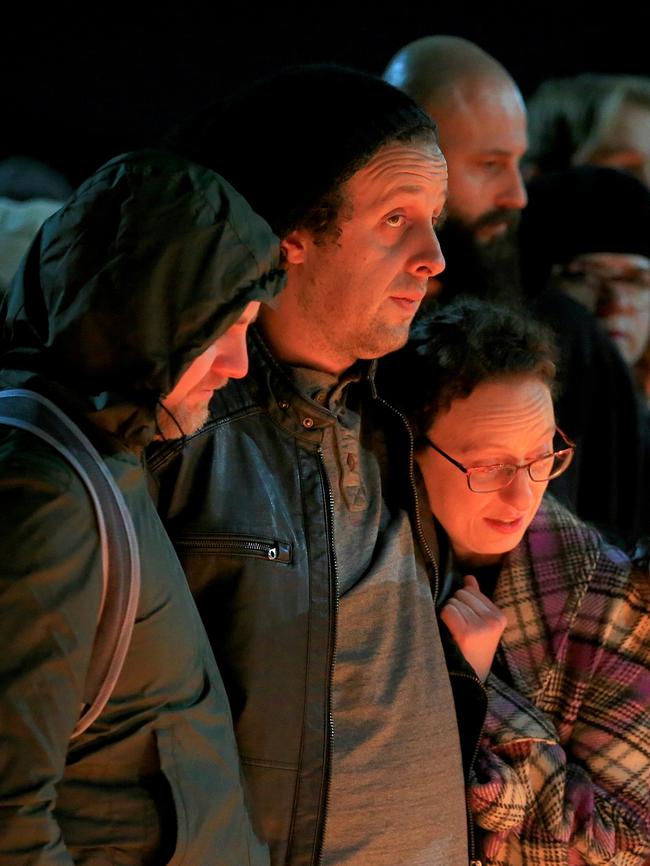 Eurydice's boyfriend, Tony Magnuson, is comforted by friends at the vigil. Picture: Mark Stewart